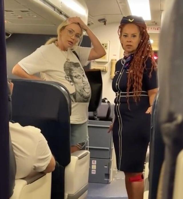In a viral video, a pregnant woman is seen voicing her dissatisfaction with her economy seat, attempting to persuade a flight attendant to let her move to first class—free of charge.